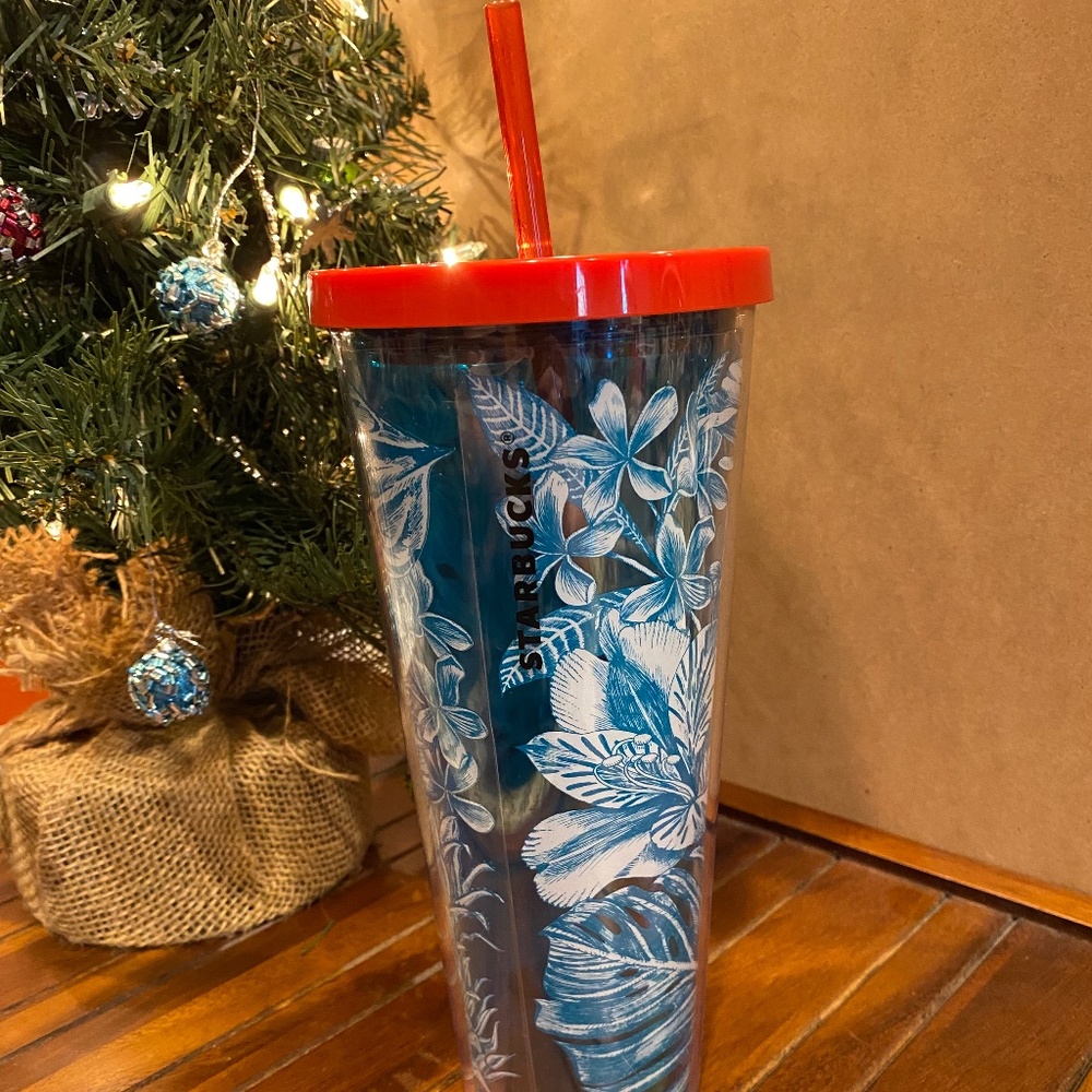 Starbucks Hawaiin theme  24 oz tumbler in turquoise with a red lid and straw.